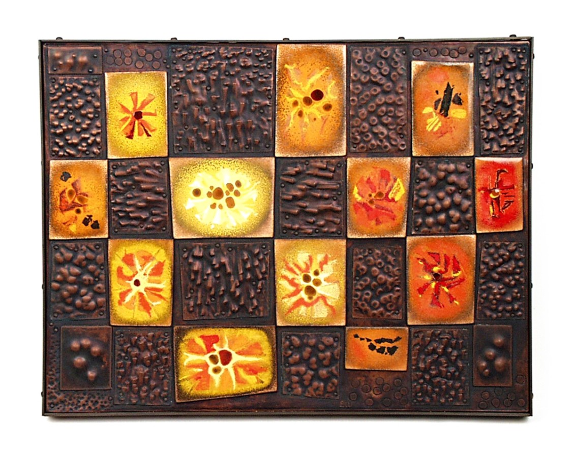 This is object is abstract enamel on copper wall panel. The design is a checkerboard pattern of abstract designs.